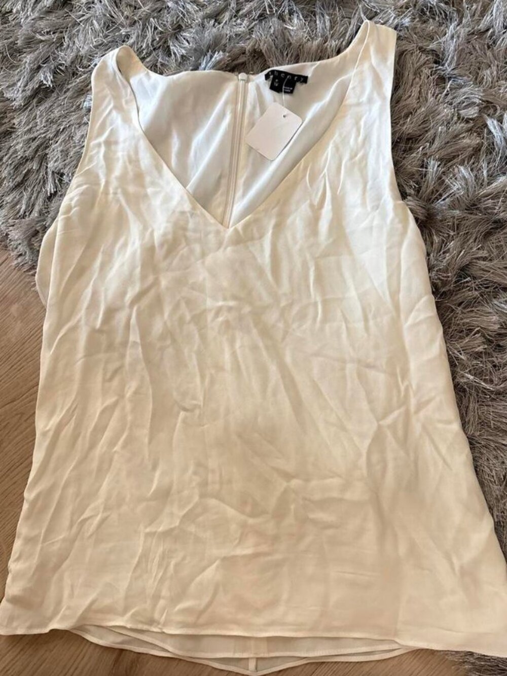 THEORY Cream blouse with a V-neckline